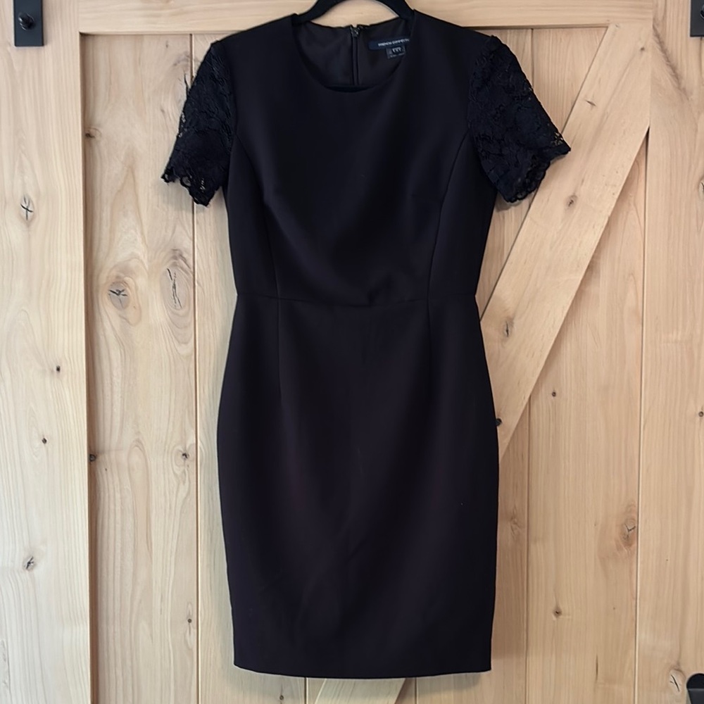 Stunning black French Connection dress with lace arms.